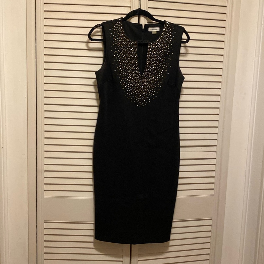 Black cocktail dress by Calvin Klein,